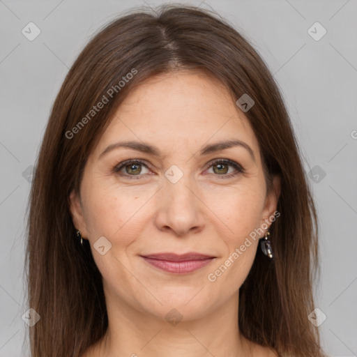 Joyful white adult female with long  brown hair and brown eyes