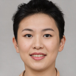 Joyful asian young-adult female with short  brown hair and brown eyes