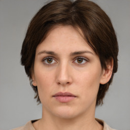 Neutral white young-adult female with medium  brown hair and brown eyes