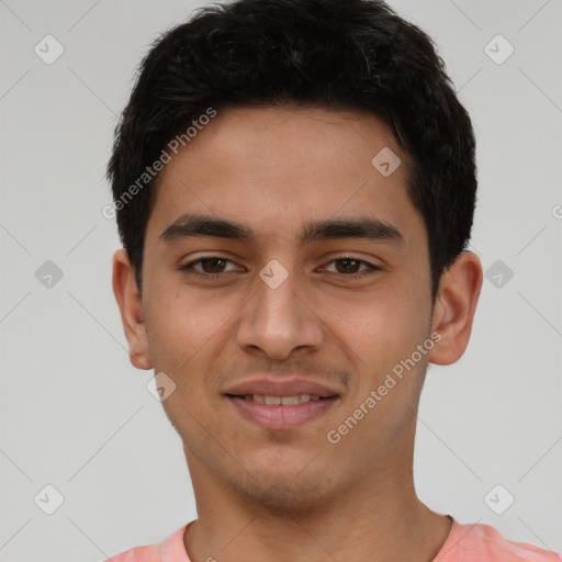 Joyful latino young-adult male with short  black hair and brown eyes