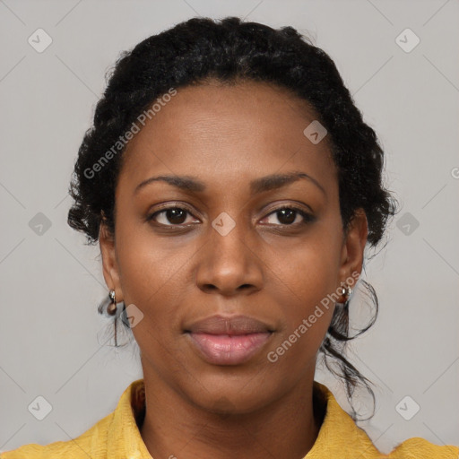 Joyful black young-adult female with medium  black hair and brown eyes