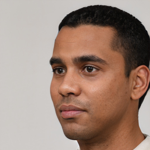 Neutral latino young-adult male with short  black hair and brown eyes