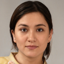 Joyful white young-adult female with medium  brown hair and brown eyes