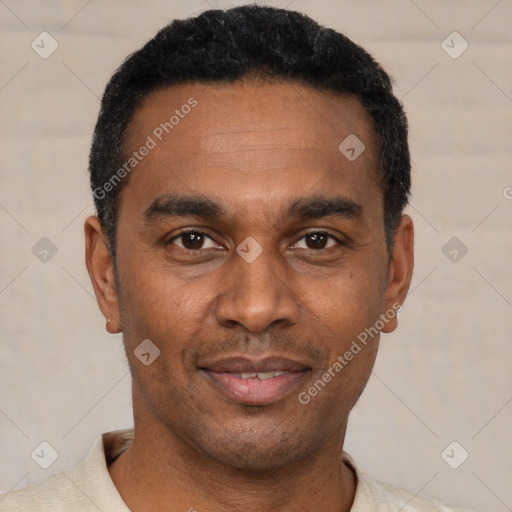 Joyful latino adult male with short  black hair and brown eyes