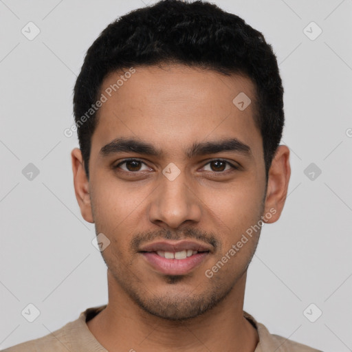 Joyful latino young-adult male with short  black hair and brown eyes