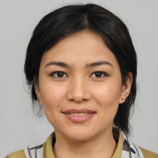 Joyful white young-adult female with medium  black hair and brown eyes