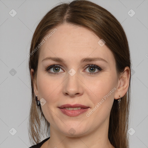 Joyful white young-adult female with medium  brown hair and grey eyes