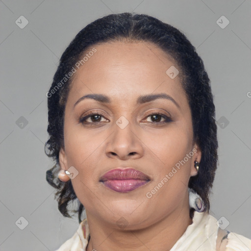 Joyful latino adult female with medium  brown hair and brown eyes