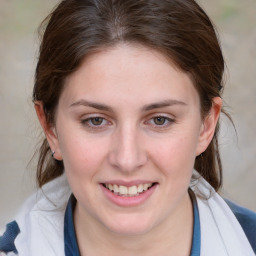 Joyful white young-adult female with medium  brown hair and blue eyes