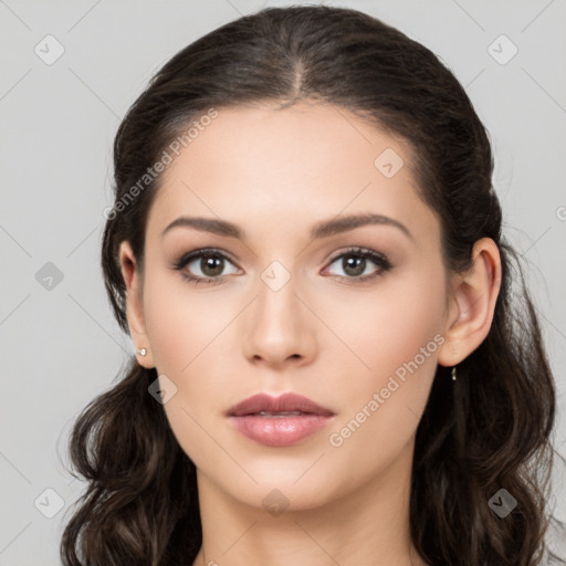 Neutral white young-adult female with long  brown hair and brown eyes