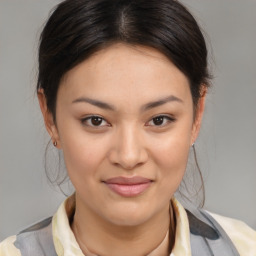 Joyful asian young-adult female with medium  brown hair and brown eyes