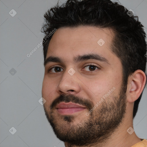 Joyful white young-adult male with short  black hair and brown eyes