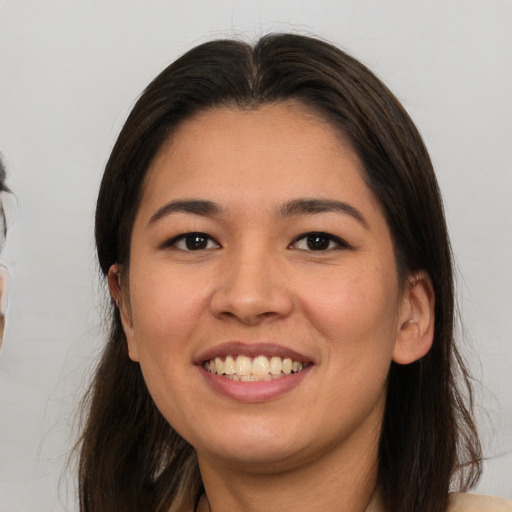 Joyful white young-adult female with medium  brown hair and brown eyes