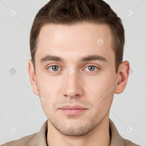 Neutral white young-adult male with short  brown hair and grey eyes