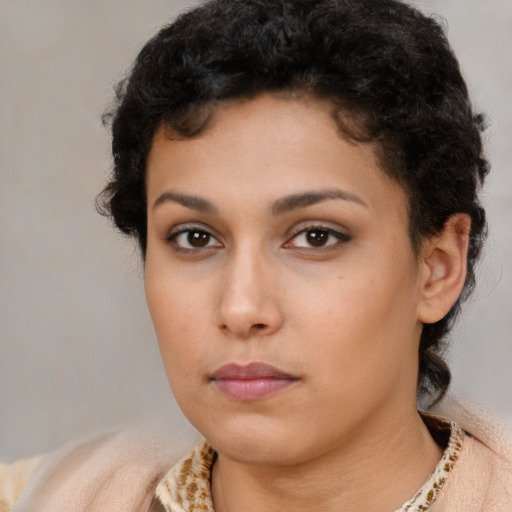 Neutral latino young-adult female with medium  brown hair and brown eyes