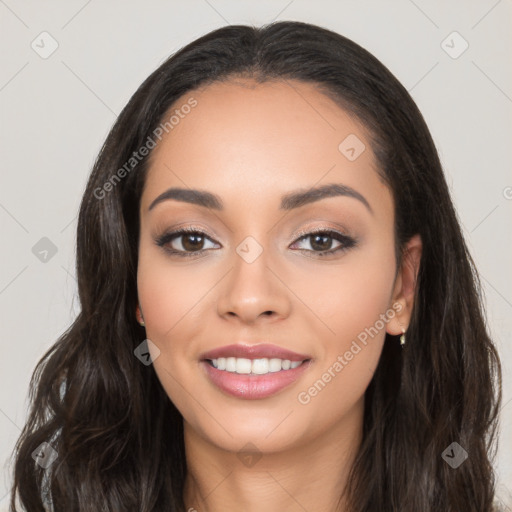 Joyful latino young-adult female with long  black hair and brown eyes