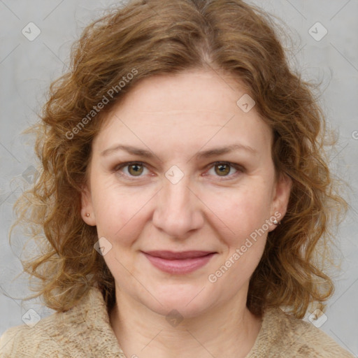 Joyful white adult female with medium  brown hair and blue eyes