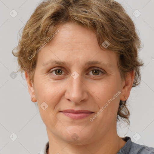 Joyful white adult female with short  brown hair and grey eyes