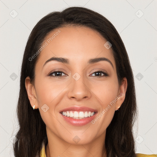 Joyful white young-adult female with long  brown hair and brown eyes