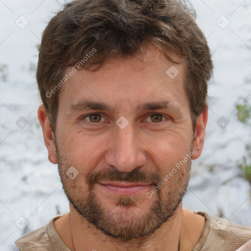 Joyful white adult male with short  brown hair and grey eyes