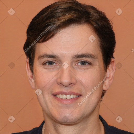 Joyful white adult male with short  brown hair and brown eyes