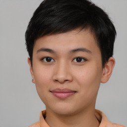 Joyful asian young-adult female with short  brown hair and brown eyes