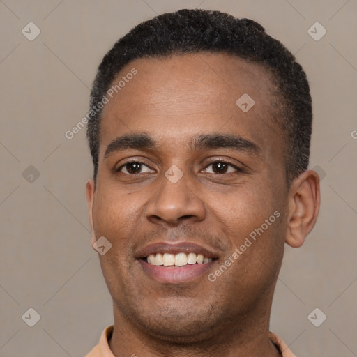 Joyful latino young-adult male with short  black hair and brown eyes