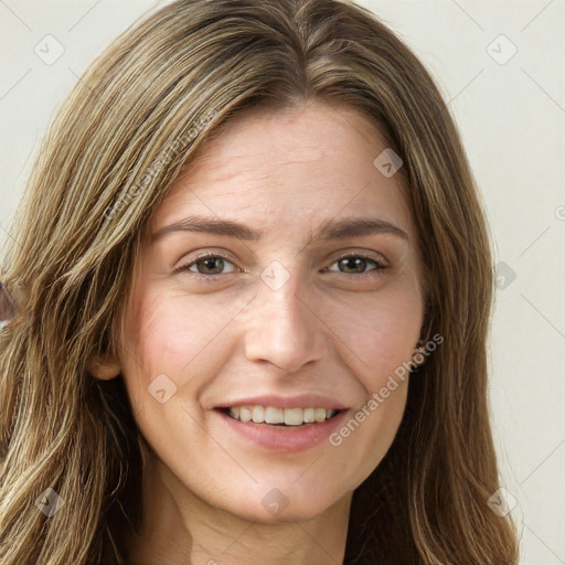 Joyful white young-adult female with long  brown hair and green eyes