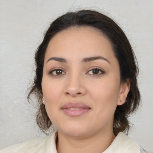 Joyful white young-adult female with medium  brown hair and brown eyes