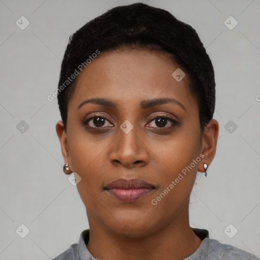 Joyful black young-adult female with short  black hair and brown eyes