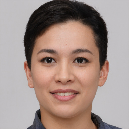 Joyful white young-adult female with short  black hair and brown eyes