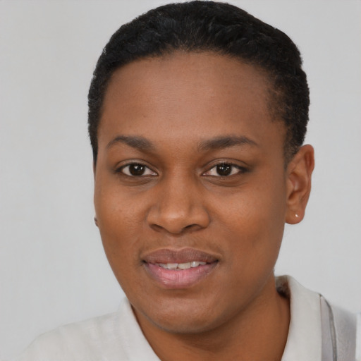 Joyful black young-adult female with short  black hair and brown eyes