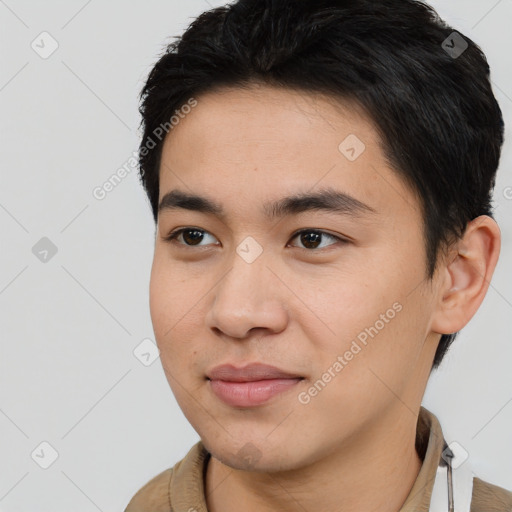 Joyful asian young-adult male with short  black hair and brown eyes