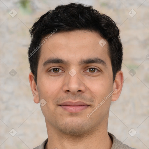 Joyful white young-adult male with short  black hair and brown eyes