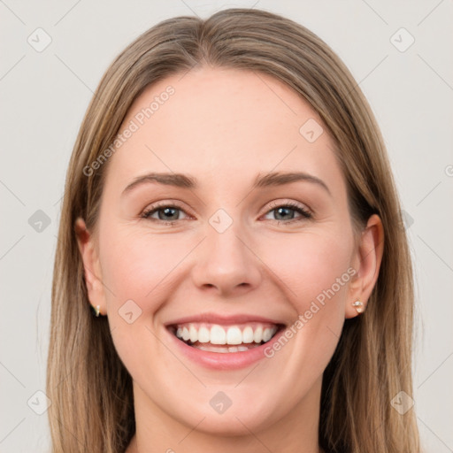 Joyful white young-adult female with long  brown hair and grey eyes