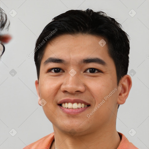 Joyful white young-adult male with short  black hair and brown eyes