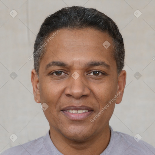 Joyful white adult male with short  black hair and brown eyes