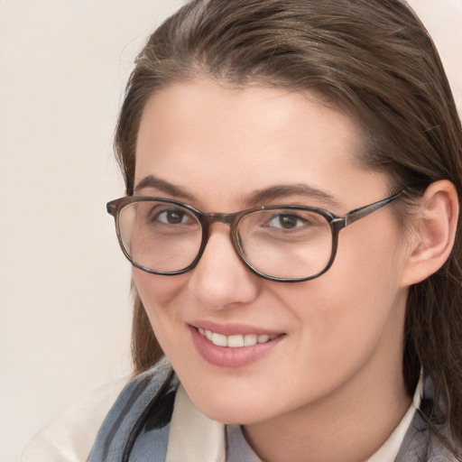 Joyful white young-adult female with medium  brown hair and blue eyes