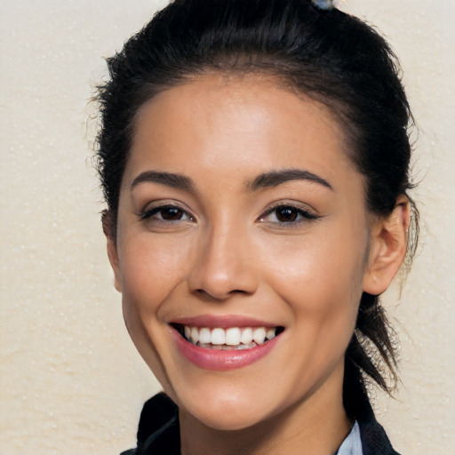 Joyful white young-adult female with long  black hair and brown eyes