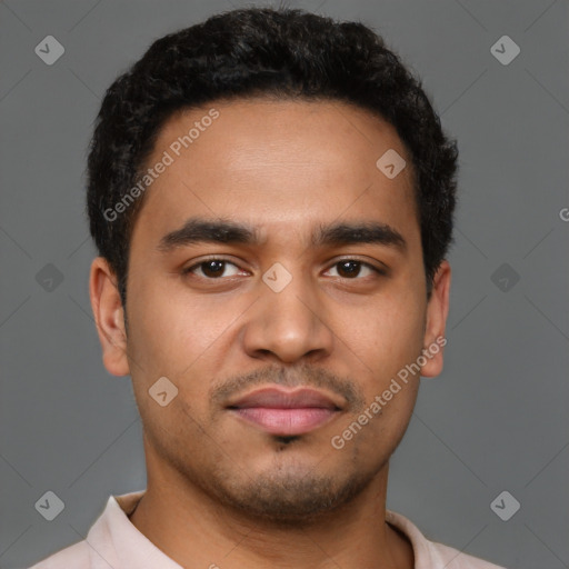 Joyful latino young-adult male with short  brown hair and brown eyes