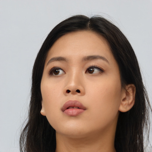 Neutral asian young-adult female with long  brown hair and brown eyes