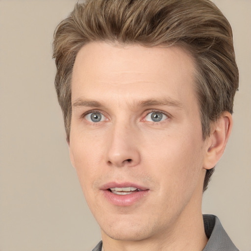 Joyful white adult male with short  brown hair and grey eyes