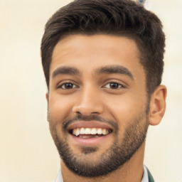 Joyful latino young-adult male with short  black hair and brown eyes