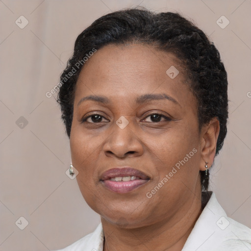 Joyful black adult female with short  brown hair and brown eyes