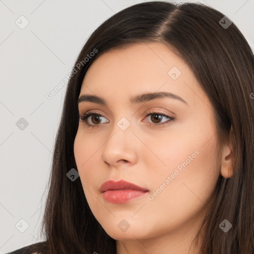 Neutral white young-adult female with long  brown hair and brown eyes