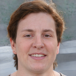 Joyful white adult male with medium  brown hair and brown eyes