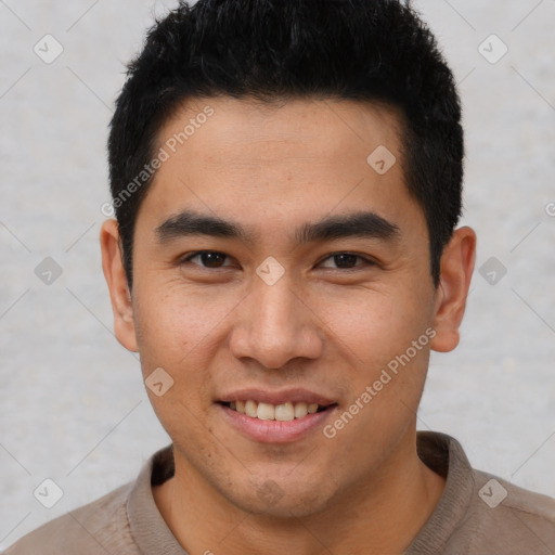 Joyful latino young-adult male with short  black hair and brown eyes