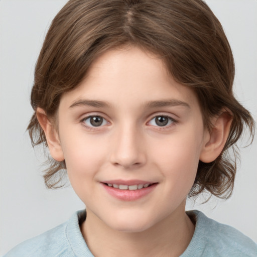 Joyful white child female with medium  brown hair and grey eyes