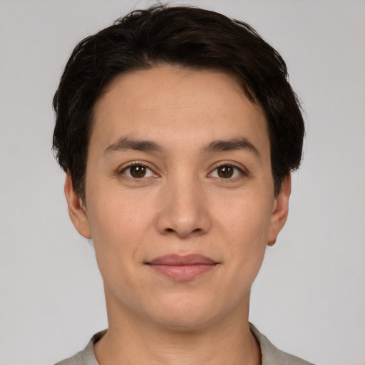 Joyful white young-adult female with short  black hair and brown eyes