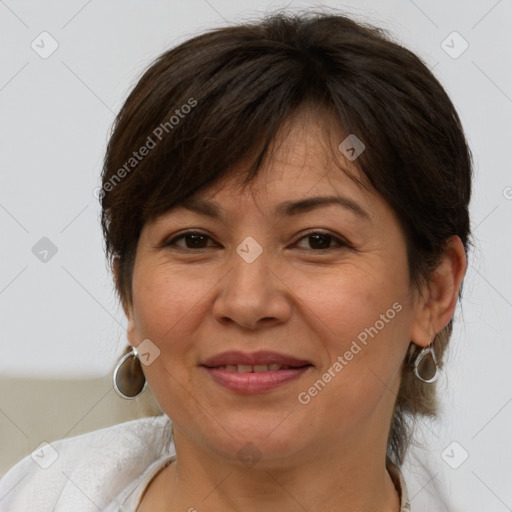 Joyful white adult female with medium  brown hair and brown eyes